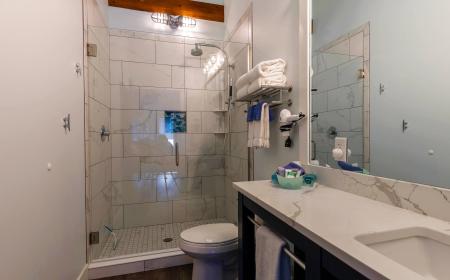Spacious Bathroom with Luxury Shower and Soaring Ceilings