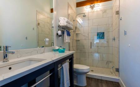 Spacious Bathroom with Luxury Shower and Soaring Ceilings
